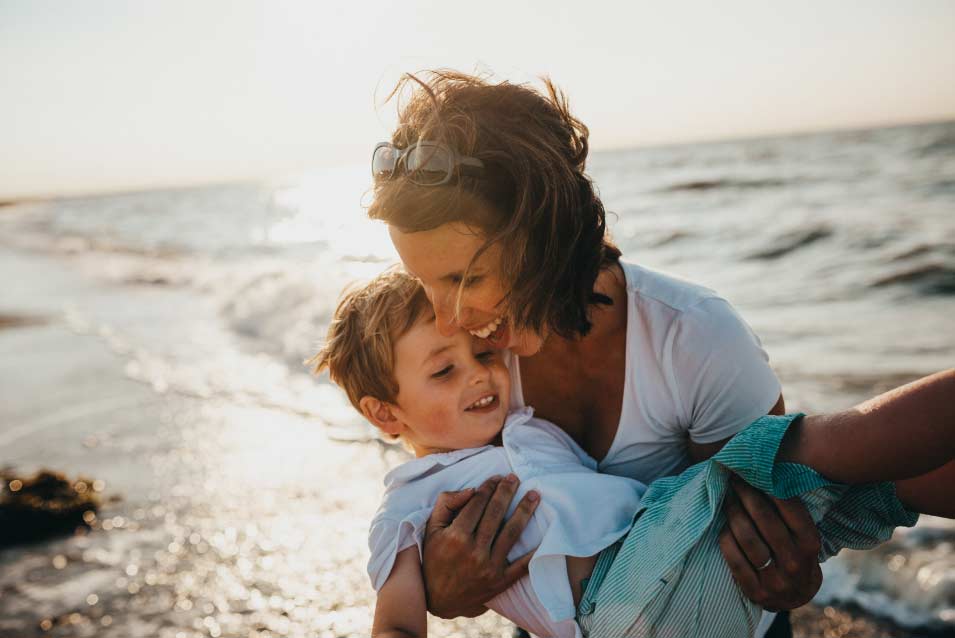 mother son beach sunset