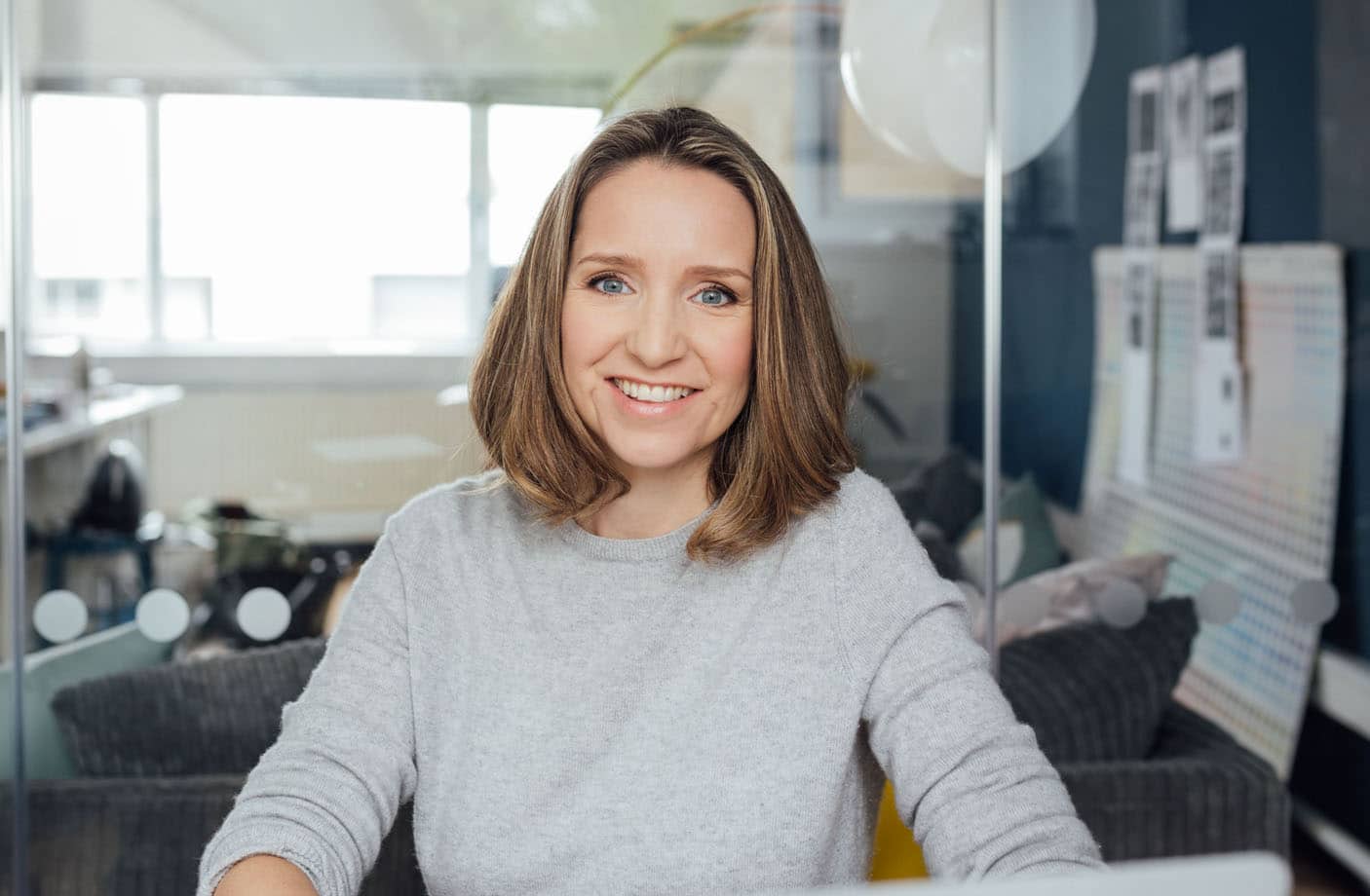 A portrait of Sarah Brown of Pai Skincare, in her office