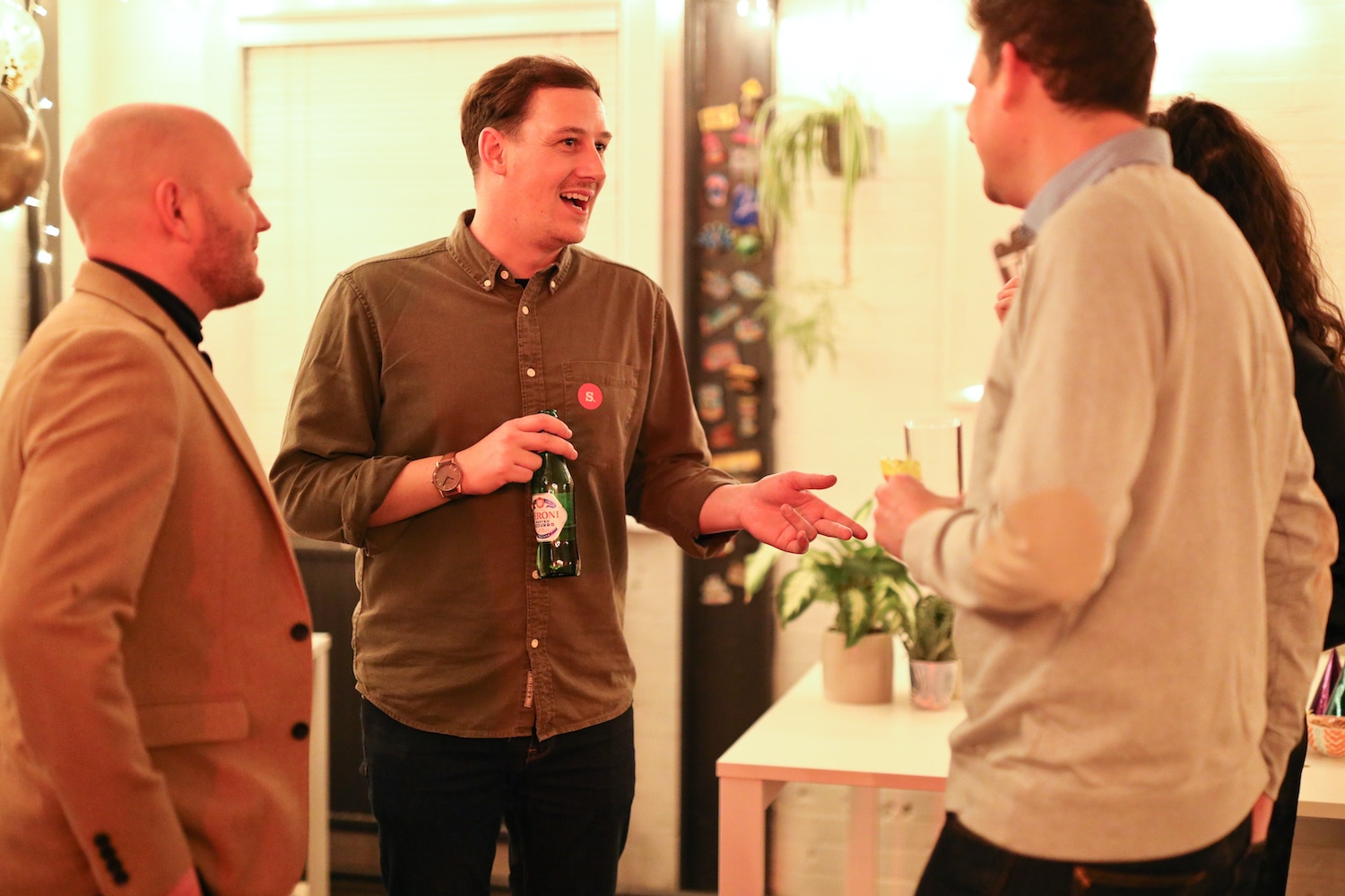 Four guests talking together